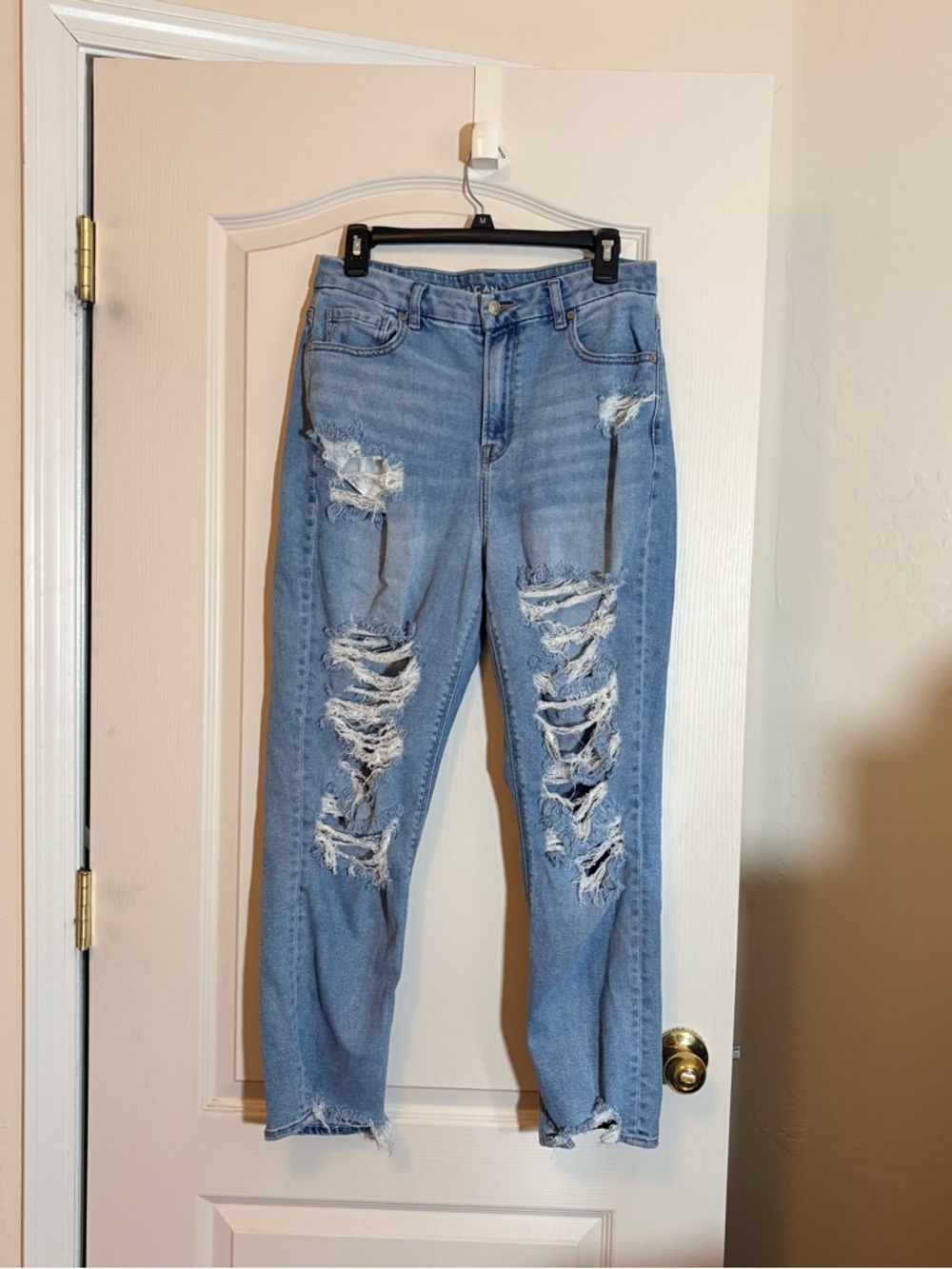 American Eagle Outfitters Curvy Mom Jeans, a high-rise fit and distressed